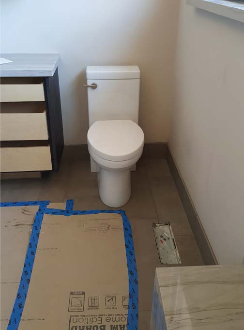 Modern kitchen sink and faucet installation during a custom home plumbing remodels project in Sacramento.