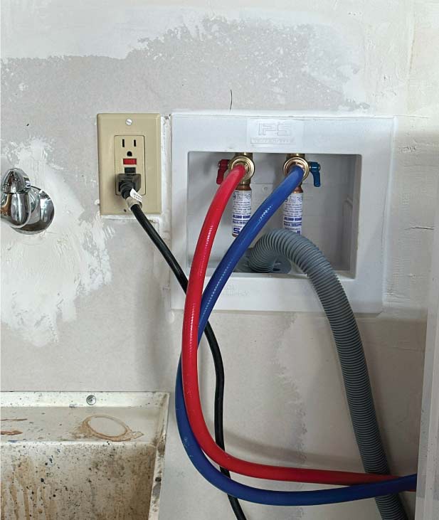 Professional plumbers installing new copper pipes for a whole-house repipe in a Sacramento home.