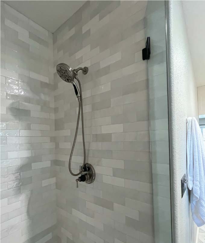 Beautifully finished bathroom with new fixtures after a successful and complete plumbing remodels installation.