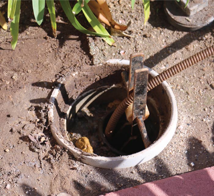 j&l plumbing performing video camera inspection to pinpoint the exact location and cause of the clog